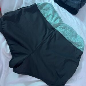 Green and black athletic shorts